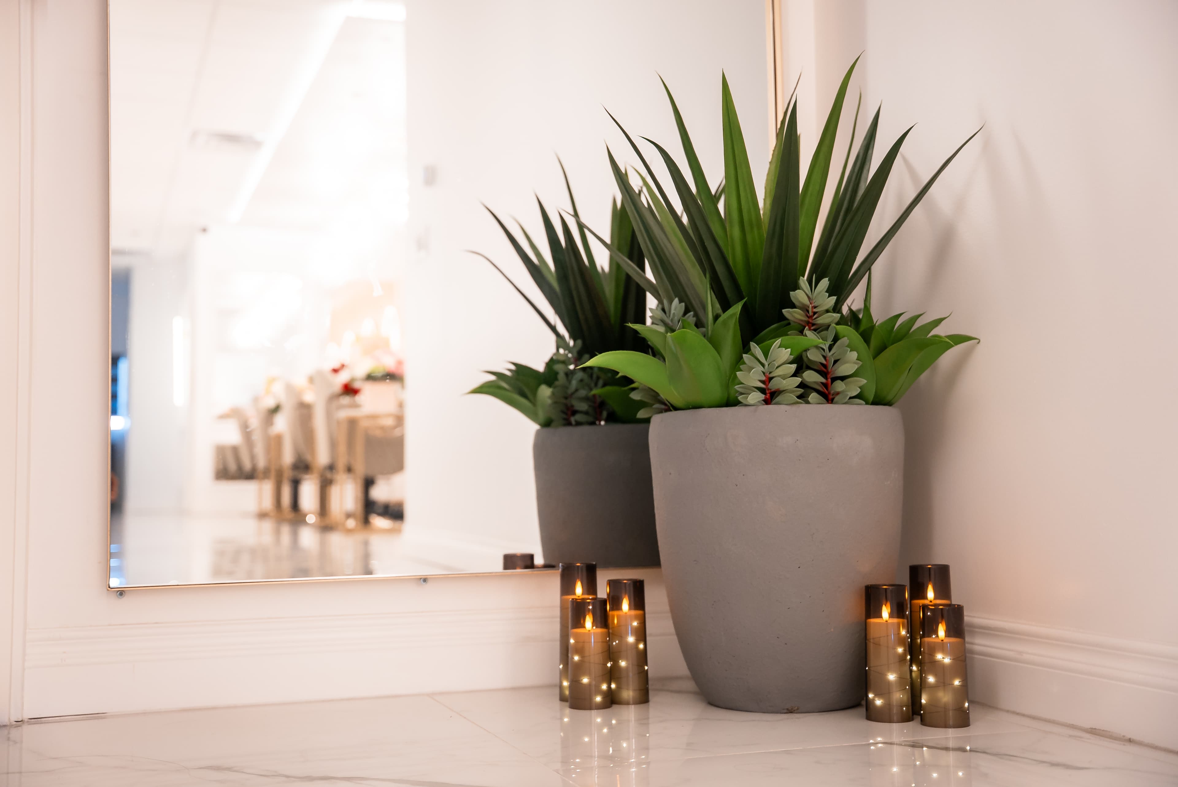 Head spa lobby entrance with plants and candle ambiance